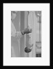 Doctor Holds New Born Baby by his Feet by Anonymous