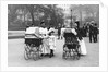 Nannies and Children Strolling in Park by Anonymous