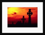 Celtic Crosses Silhouetted at Sunset by Corbis