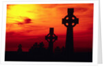 Celtic Crosses Silhouetted at Sunset by Corbis