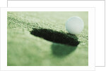 Golf Ball on the Edge of the Hole by Anonymous