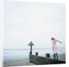 Woman Balancing on a Breakwater by Anonymous