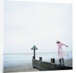Woman Balancing on a Breakwater by Anonymous