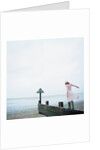 Woman Balancing on a Breakwater by Anonymous