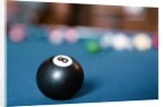 Eight ball on pool table by Anonymous
