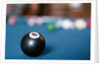 Eight ball on pool table by Anonymous