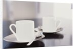 Two coffee cups on a table by Anonymous