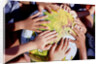 Children's Hands on Inflatable Globe by Anonymous