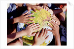 Children's Hands on Inflatable Globe by Anonymous