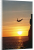 Cliff Diver Above Setting Sun by Anonymous