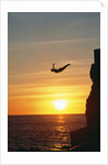 Cliff Diver Above Setting Sun by Anonymous