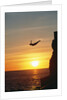 Cliff Diver Above Setting Sun by Anonymous