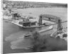 Cargo Boat Passing Under Bridge by Anonymous