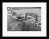 Cargo Boat Passing Under Bridge by Anonymous