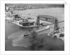 Cargo Boat Passing Under Bridge by Anonymous