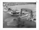 Cargo Boat Passing Under Bridge by Anonymous