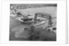 Cargo Boat Passing Under Bridge by Anonymous