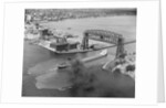 Cargo Boat Passing Under Bridge by Anonymous