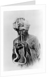 Indian Snake Charmer with Reptile up His Nose by Anonymous