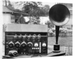 Display of an Early Radio on Residential Lawn by Anonymous