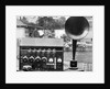 Display of an Early Radio on Residential Lawn by Anonymous