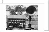 Display of an Early Radio on Residential Lawn by Anonymous