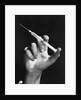 Hand Holding Syringe by Anonymous