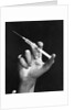 Hand Holding Syringe by Anonymous