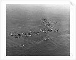 View of SBD Dive Bombers Flying Above Carrier by Anonymous