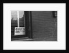 Sign Posted in Window of Building by Anonymous