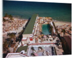 People Enjoying Pool at Beach Resort by Anonymous