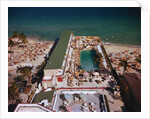 People Enjoying Pool at Beach Resort by Anonymous