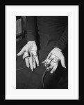 Pair of Hands Wearing Lie Detector Device by Anonymous