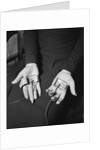 Pair of Hands Wearing Lie Detector Device by Anonymous