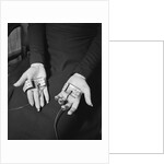 Pair of Hands Wearing Lie Detector Device by Anonymous