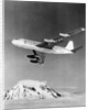 Large Aircraft Flying over Mountainous Region by Anonymous