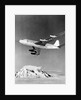 Large Aircraft Flying over Mountainous Region by Anonymous