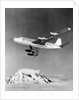 Large Aircraft Flying over Mountainous Region by Anonymous