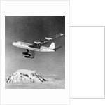 Large Aircraft Flying over Mountainous Region by Anonymous