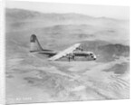 Airplane Flying Over Landscape by Anonymous