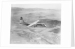 Airplane Flying Over Landscape by Anonymous