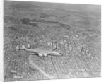 Airplane Flying Over Los Angeles by Anonymous