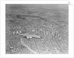Airplane Flying Over Los Angeles by Anonymous