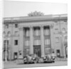 Cars Parked in Front of a Hotel by Anonymous