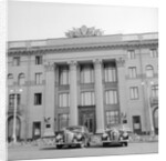 Cars Parked in Front of a Hotel by Anonymous