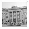 Cars Parked in Front of a Hotel by Anonymous