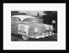 Automobile Decorated with Signs and American Flags by Anonymous