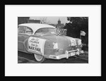 Automobile Decorated with Signs and American Flags by Anonymous