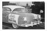 Automobile Decorated with Signs and American Flags by Anonymous