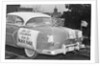 Automobile Decorated with Signs and American Flags by Anonymous